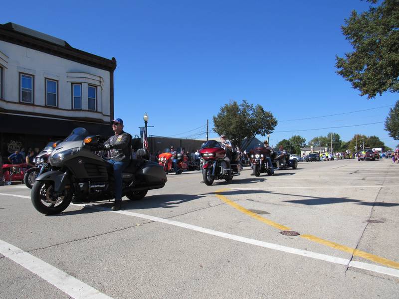 The American Legion Riders make their way down Liberty Street during the Grundy County Corn Festival on Sunday.
