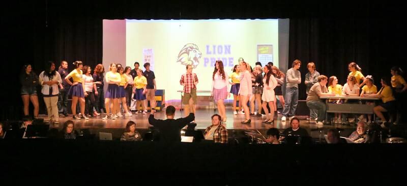 Members of the cast of "Mean Girls-High School Version act out a scene out a scene during a rehearsal on Monday, March 10, 2025 in Matthiessen Auditorium at La Salle-Peru Township High School.