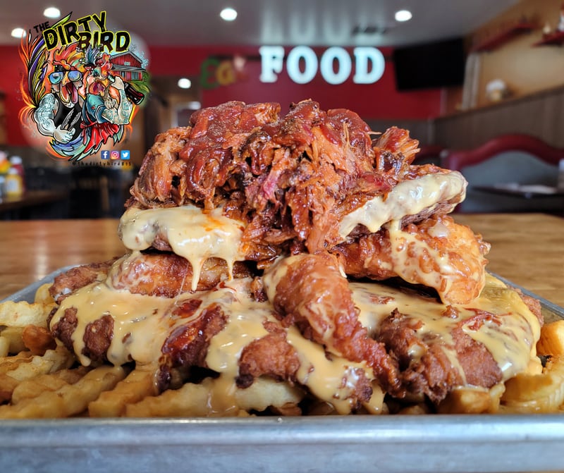 The Big Berty Challenge at the Dirty Bird 815 in Sycamore requires patrons to eat every bite of two and a half pounds of fries, a pork tenderloin, five chicken strips, two quarter-pound cheeseburger patties, and half a pound of pulled pork – all covered in house queso – in 30 minutes. Only one person has ever completed the task, and Youtube star Randy Santel will give it a go this on Sunday, Jan. 28, 2023, live on his Youtube channel.