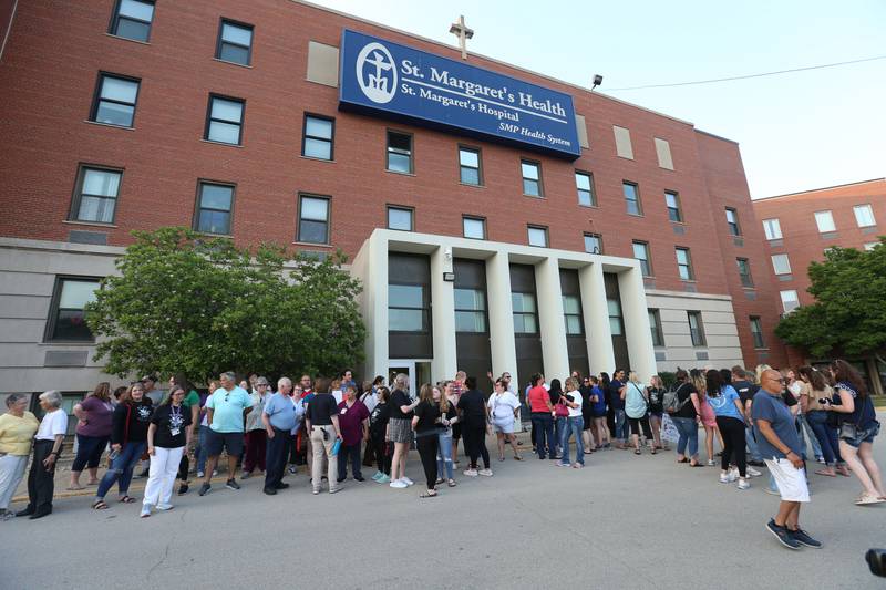 St. Margaret's employees and supporters gather for a photo at St. Margaret's Hospital on Friday, June 16, 2023 in Spring Valley.