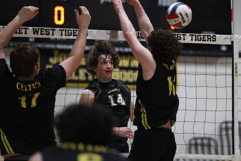 Joliet West’s Thomas Fellows deflects a shot off the Providence defense for a point on Thursday, March 23, 2023 in Joliet.