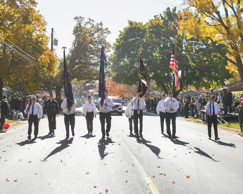 Area military veterans present the colors at the start of the Pumpkin Parade on Sunday Oct. 28, 2024, downtown at the 63rd annual Sycamore Pumpkin Festival.