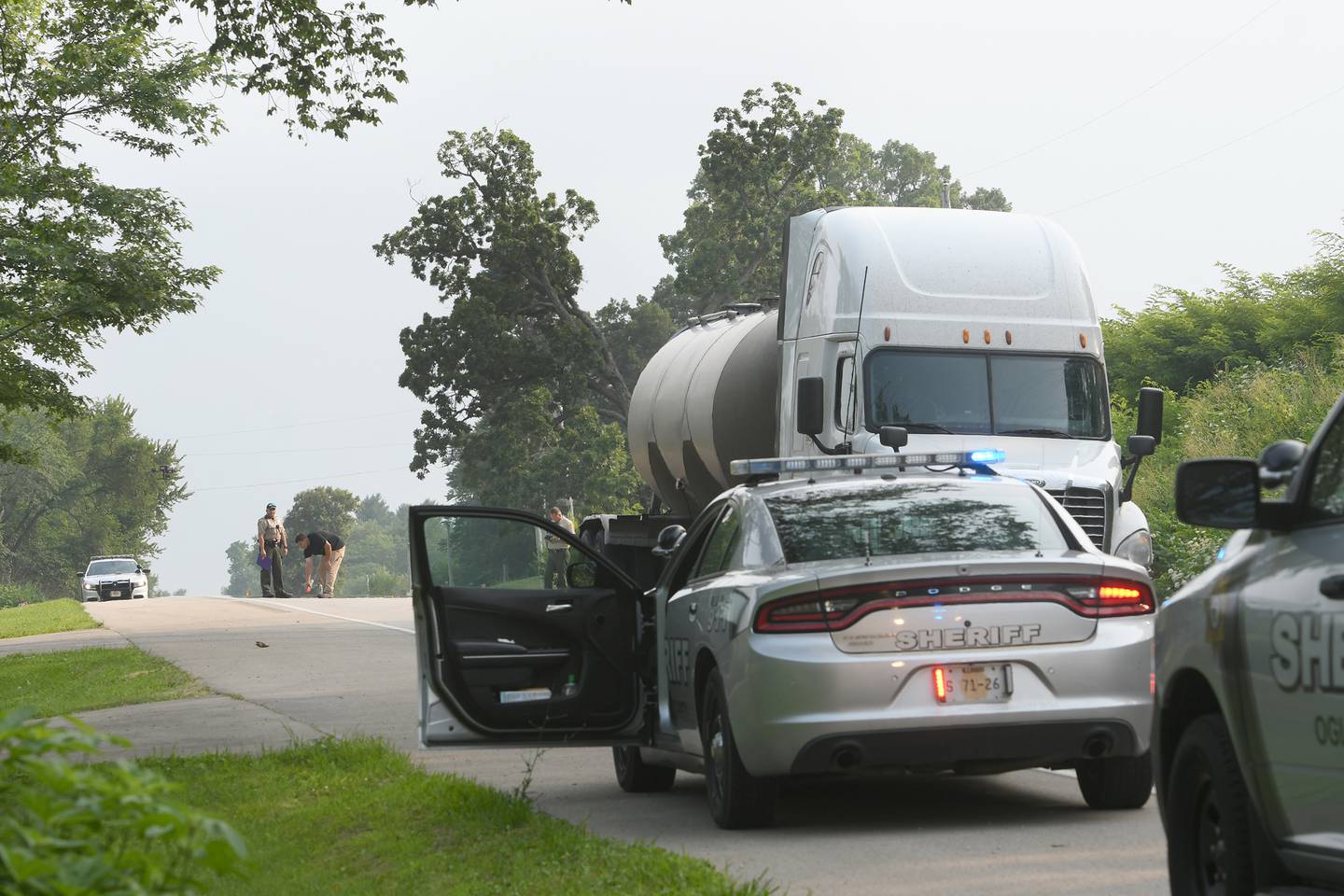 Ogle County Sheriff Brian Van Vickle along with his deputies and Illinois State Troopers perform an accident reconstruction in the 4400 block of Illinois Route 2 on Wednesday after Patricia A. Jones, 86, was struck by a semi-truck while crossing the state highway near her home. Jones was airlifted to a Rockford Hospital and the road remained closed for 2 hours while the investigation continued.