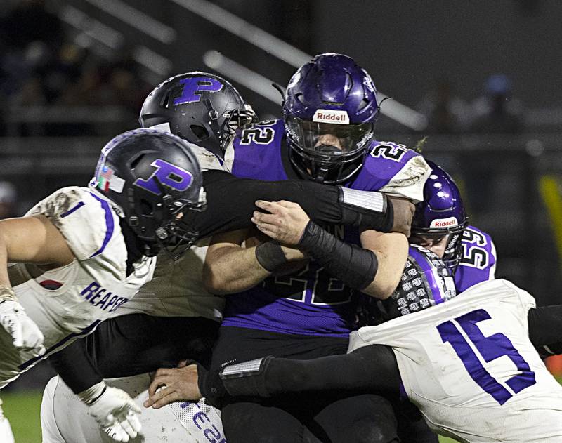 Dixon’s Aiden Wiseman picks up yards against Plano Friday, Oct. 27, 2023 in Dixon.