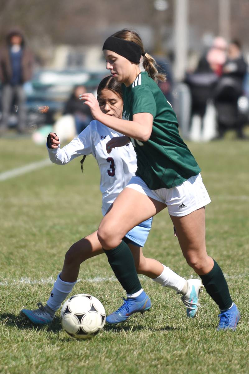Bishop McNamara's Ava Brockell, right, dribbles down the pitch as Kankakee's Lenzith Delacruz defends during an All-City game at McNamara Saturday, March 22, 2025.