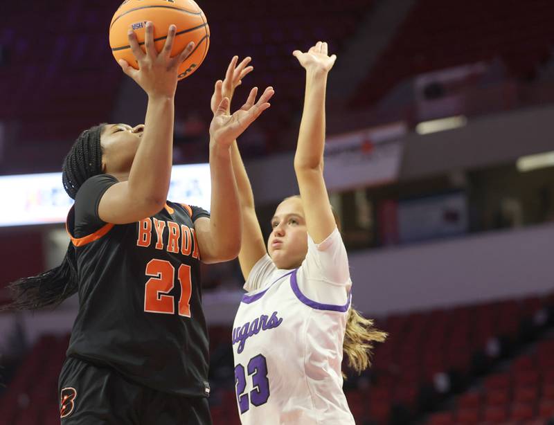 Byron's Malia Morton eyes the hoop while working in the lane against Breese Central's Alexa Morris during the Class 2A title game on Saturday, March 7, 2026 at CEFCU Arena in Normal.