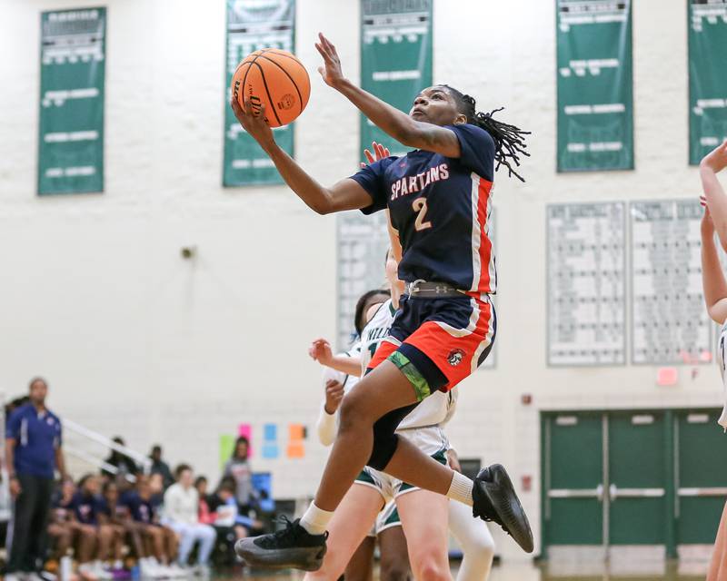 Romeoville's Kazaria Smith (2) flies in for a layup during their basketball game between Romeovile at Plainfield Central, Thursday Dec 5, 2024  in Plainfield.