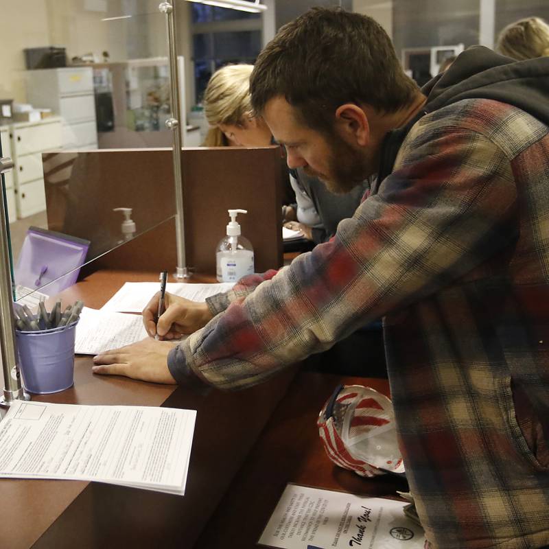 Jeremy Miller, who is running for the Richmond-Burton High School District 157 school board, files his candidate forms on Monday, Nov. 18, 2024, at the McHenry County Clerk's Office in Woodstock.  Monday was the final day of filing for the consolidated election on April 1, 2025.