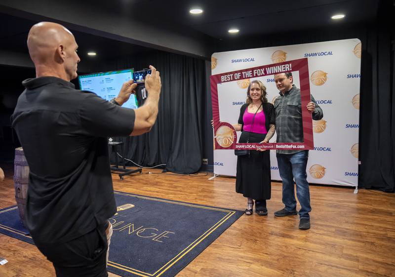 David Meintz of McHenry takes a photo of business owners Stephanie and Rich Conley of Steph's Bookkeeping Services in McHenry during the Northwest Herald Best of the Fox awards ceremony on Thursday, September 19, 2024 at Lou's Lounge at the Dole Mansion in Crystal Lake. Ryan Rayburn for Shaw Local