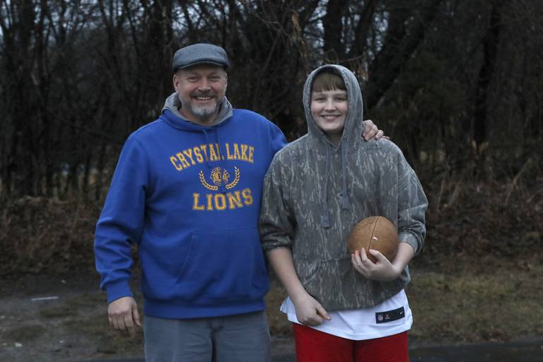 Big brother Dave with his little brother, Chase, 13, after tossing a football around on Thursday, Jan 20, 2023 in Crystal Lake as they hang out to gather. The two are are part of the Big Brothers Big Sisters of McHenry program.