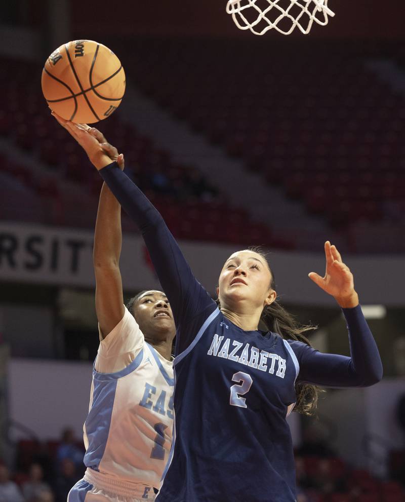 Bellville East’s Denaya Bartelheim fouls Nazareth's Samantha Austin Friday, March 6, 2026, in the Class 4A girls state semifinal game at CEFCU Arena at ISU.