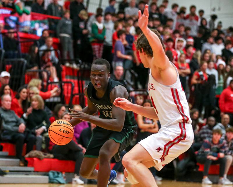 Glenbard West's Josh Abushanab (10) makes a baseline move during their basketball game between Glenbard West at Hinsdale Central, Friday  Dec 6, 2024  in Hinsdale.
