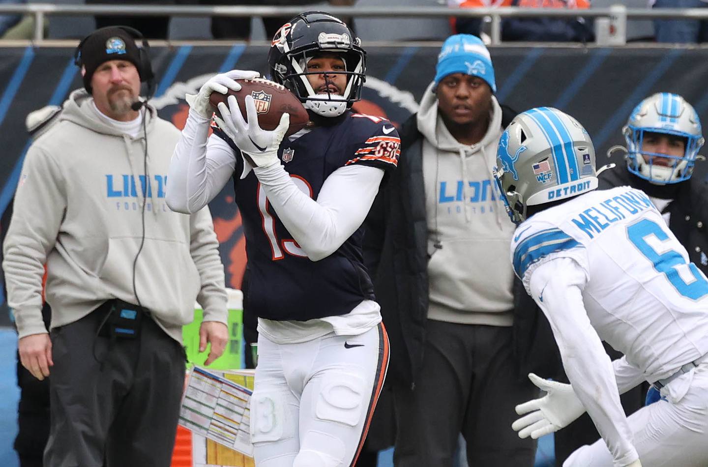 Chicago Bears wide receiver Keenan Allen catches a touchdown pass in front of Detroit Lions safety Ifeatu Melifonwu as Lions head coach Dan Campbell looks on during their game Sunday, Dec. 22, 2024, at Soldier Field in Chicago.