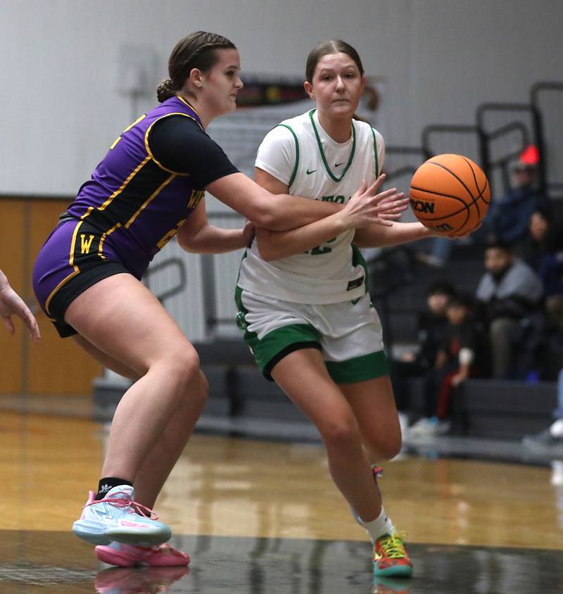 Crystal Lake South's Gaby Dzik brings the ball up the courts against Wauconda's Kelsey Piehl during the Northern Illinois Holiday Classic Championship girl basketball game on Thursday, Dec. 18, 2025, at McHenry High School.