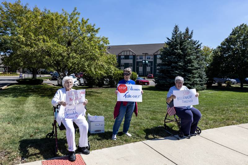 Participants rally on the sidewalk near N. River Road during a Labor Day Protest in Shorewood, IL, on Sept. 1, 2025.