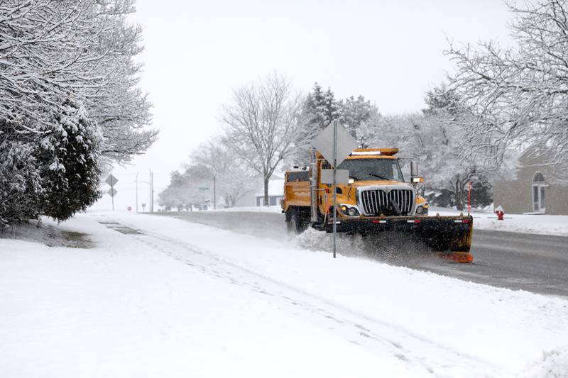 A snow plow travels through Geneva on Wednesday, Jan. 25, 2023.