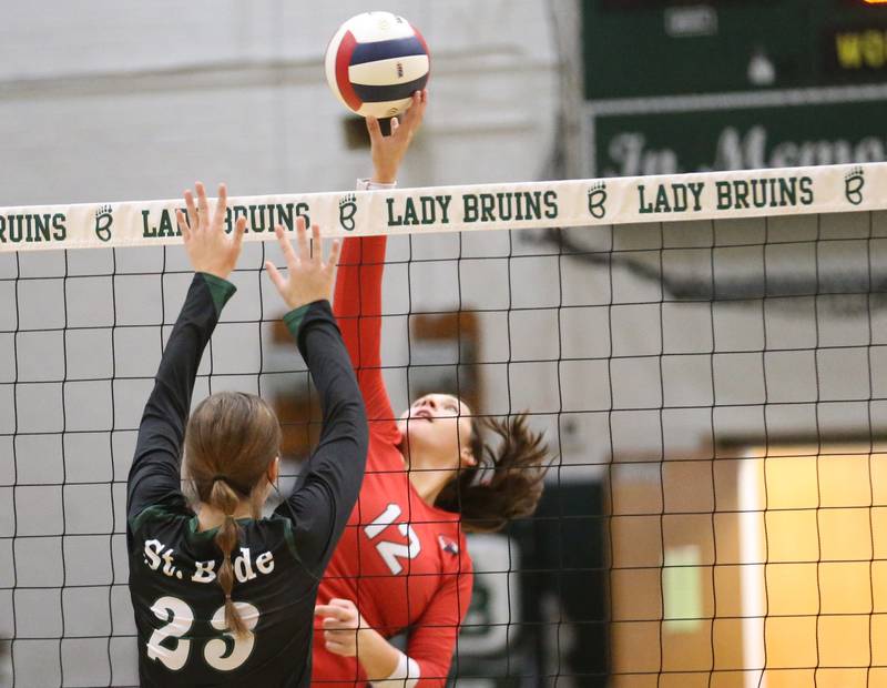 Henry-Senachwine's Kaitlyn Anderson sends the ball past St. Bede's Mary Quinn McClain during the Class 1A Regional final game on Thursday, Oct. 31, 2024 at St. Bede Academy.
