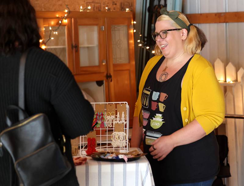 Nikki Rice (right) talks to a customer at her booth Fancy Work Macrame Tuesday, June 3, 2025, during the the Sycamore Farmers Market, hosted by Kar-Fre Flowers and Gifts. The market will be held Tuesdays from 3-6 p.m. through August 26 at Kar-Fre Flowers. Some of the market was held indoors due to the weather.