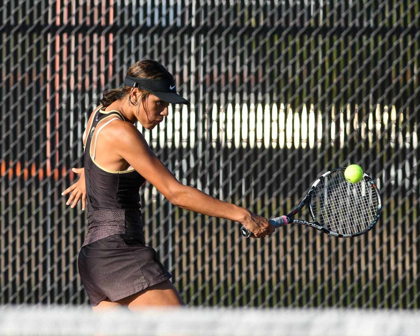 Liliana Vasquez returns a volley in the second single match on Thursday Sept. 25, 2025, while traveling to take on DeKalb High School.