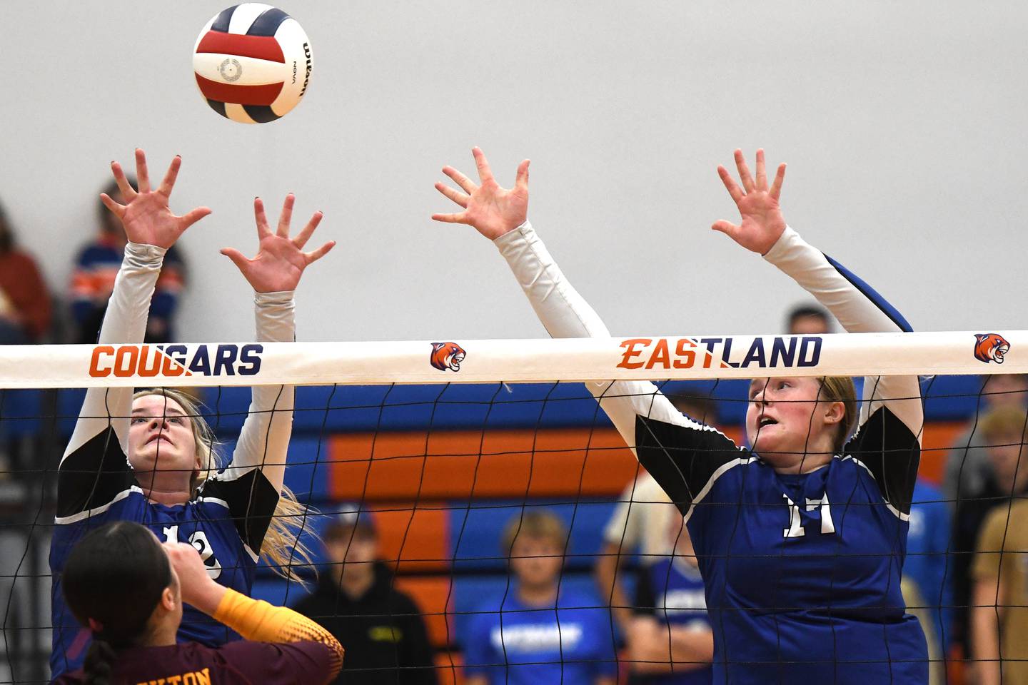 Newark's Ela Bromeland (left) and Zoey Carlson try and block a Stockton spike  during the first set at the 1A Eastland sectional on Tuesday, Nov. 4, 2025 in Lanark.