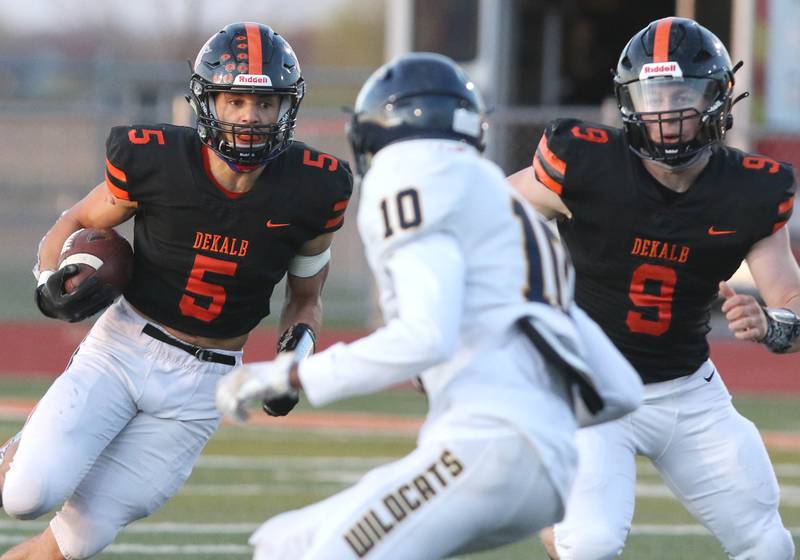 DeKalb running back Toriano Tate finds some room to run in the Neuqua Valley defense during their game Friday night at DeKalb High School.