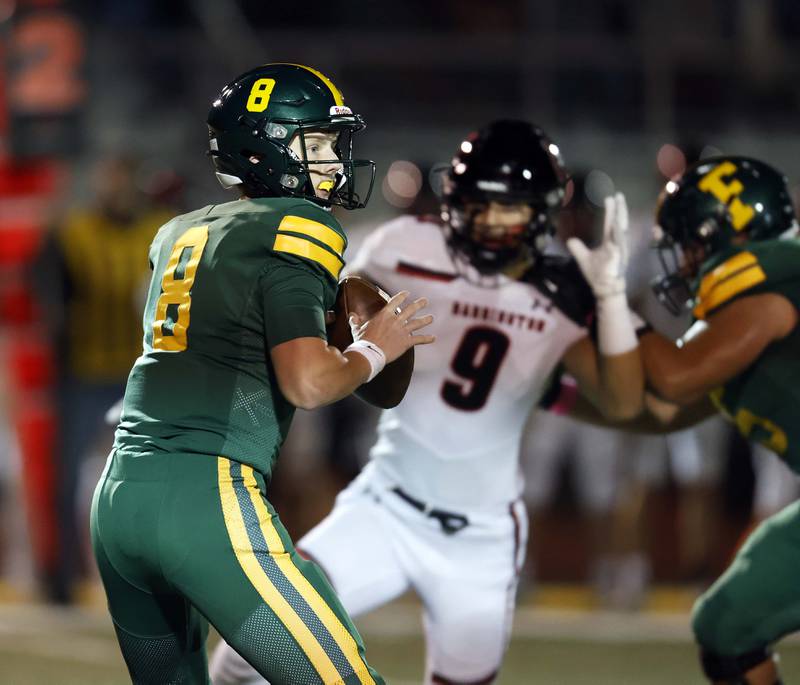 Fremd's Johnny O'brien (8) look for an open teammate Friday, Oct. 4, 2024 in Palatine.