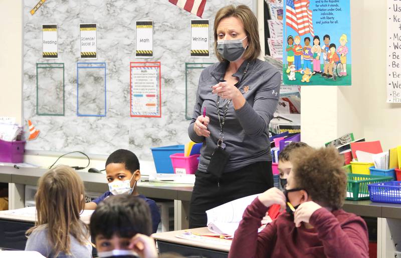 Amy Russell teaches her third grade class at Littlejohn Elementary School about expenses and how to save money, during class Friday, Jan. 21, 2022, at the school in DeKalb.