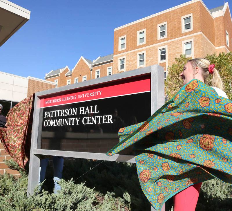 The new sign is unveiled Friday, Oct. 7, 2022, during a ceremony where New Residence Hall at Northern Illinois University is renamed Fanny Ruth Patterson Complex. In 1915 Patterson was the university’s first Black graduate and the complex including the Community Center is being named in her honor.