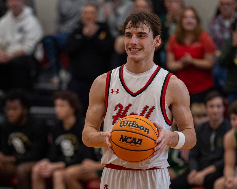 Braden Curran (33) of Hall holds ball after scoring 1,000th career point against St. Bede on Saturday, January 31, 2026 at Hall High School in Spring Valley.