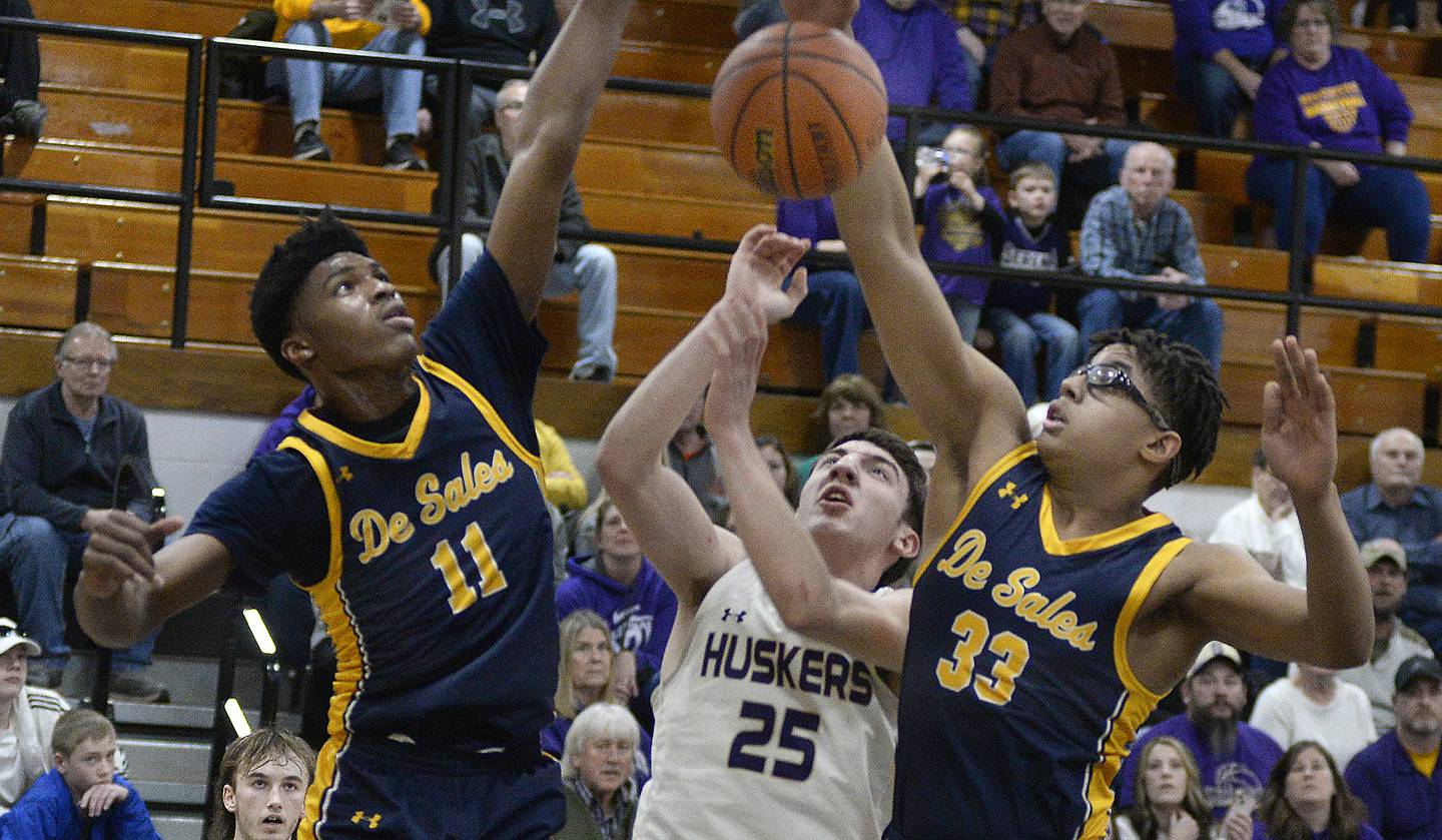 Serena’s Richie Armour battles St Francis De Sales Brandon Lowe Jr and Cyril Nichols Jr for a rebound in the 1st period during the Class 1A Sectional final on Friday, March 3, 2023 at Putnam County High School.