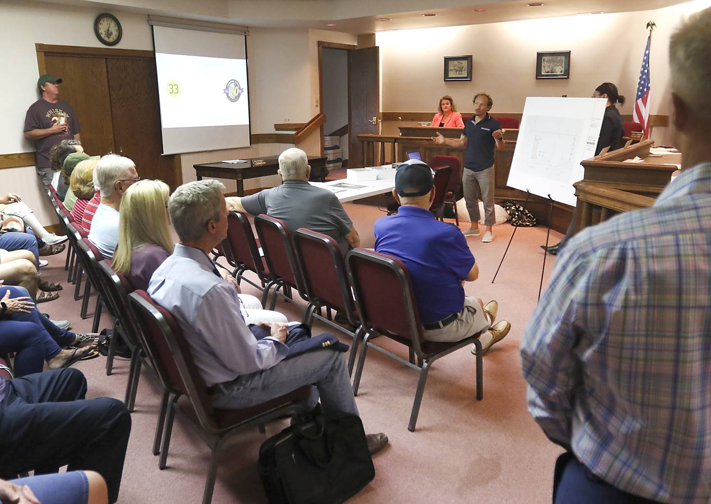 Zachary Zises, owner of 280E LLC, presents the plans for a proposed cannabis dispensary Thursday, Aug. 18, 2022, to a standing room only crowd attending a listening session at Richmond Village Hall. The proposal is set to be voted on by the Village Plan Commission at a meeting at 6 p.m. Monday, Aug. 22. Most the the residents at the listening session voiced their approval of the dispensary, but we opposed to the proposed location is at 5500 Swallow Ridge Drive, just off a busy stretch of Highway 12 just south of where Burlington Road branches off the highway.