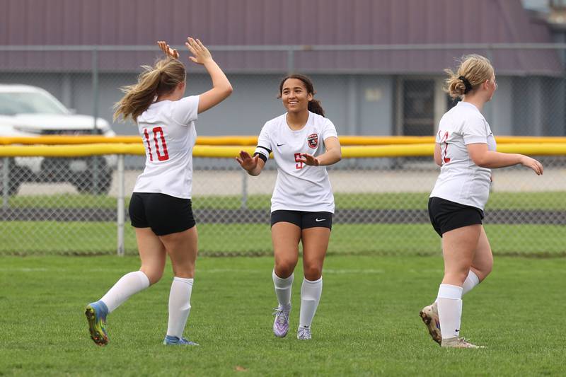 Bradley-Bourbonnais' Nia Lawrence, center, is congratulated by teammate Harper Tollefson, left, after scoring a goal during the Boilermakers' 9-1 win over Bishop McNamara in All-City play on Tuesday, March 31, 2026.