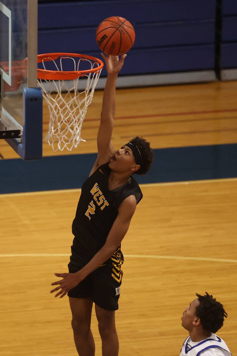 Joliet West’s Jeremiah Fears lays in a shot against Joliet Central.