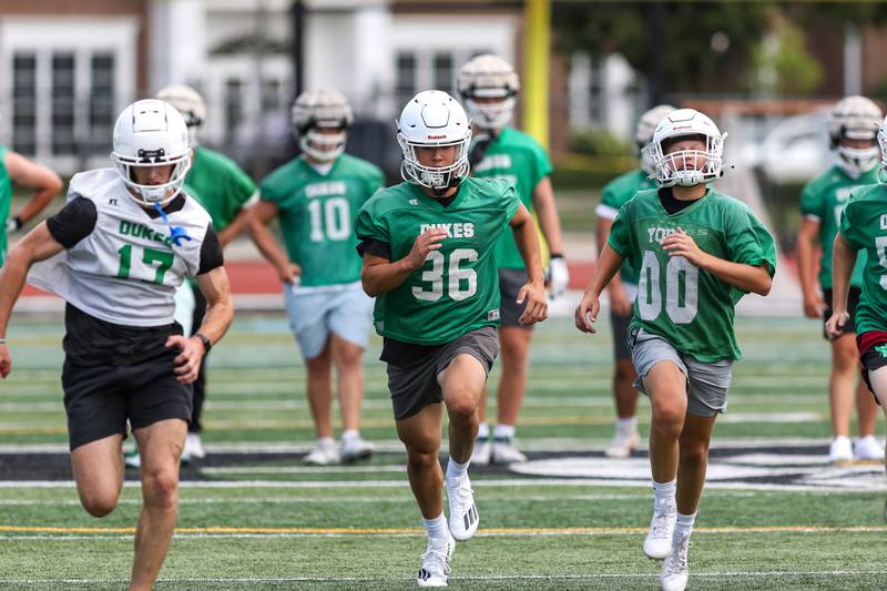 The team goes through conditioning drills at the start of York High School first day of football practice. Aug 12, 2024.