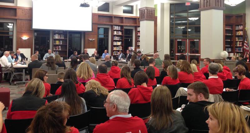 YEA supporters are wearing red t-shirts Monday night shortly before the Yorkville School district board meeting.