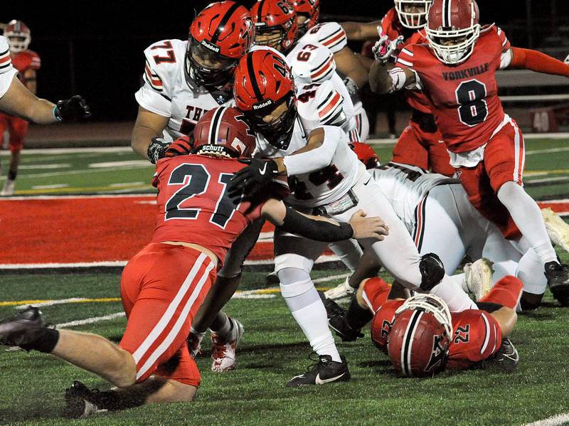 Bolingbrook running back Alexander Sogavo (44) powers for yards against the Yorkville defense on Friday, Sept. 27, 2024, during a varsity game at Yorkville High School.