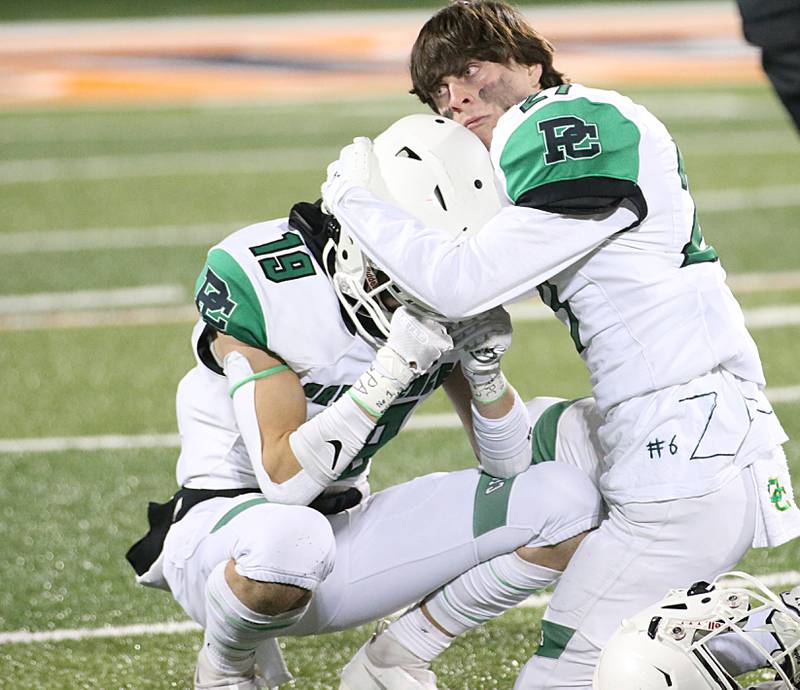 Providence Catholic's Mason Straight (19) reacts as teammate George Beeson (27) consoles him in the Class 4A state title on Friday, Nov. 25, 2022 at Memorial Stadium in Champaign.