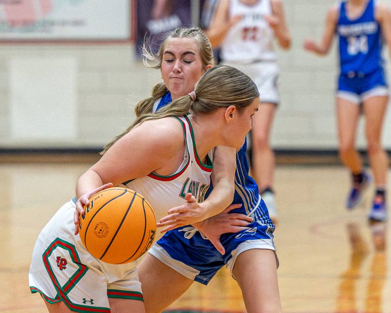 L-P's Emma Jereb (5) dribbles ball down lane as Princeton’s Kiyrra Morris (5) swipes to steal on Saturday, Feb. 7, 2026 in Sellett Gymnasium at L-P High School.