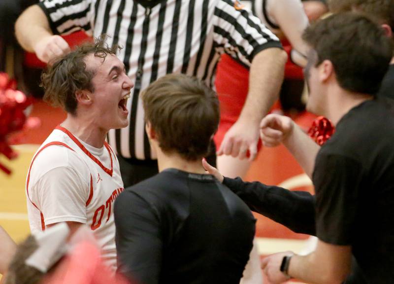 Ottawa's Levi Sheehan celebrates with superfans after defeating L-P in Kingman Gymnasium on Friday, Feb. 10, 2023 at Ottawa High School.