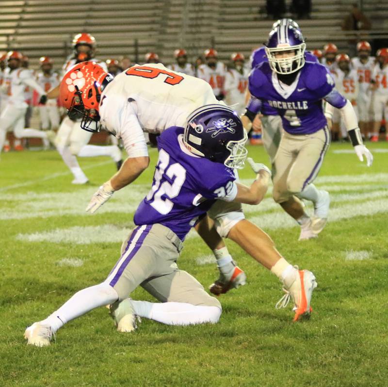 Rochelle's Luke Chadwick (32) tackles a Waterloo player during their game Friday, Oct. 24, 2025 in Rochelle.