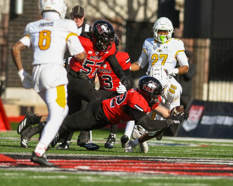 Northern Illinois University's linebacker Quinn Urwiler (32) intercepts the ball during the game on Friday Nov. 28, 2025, while taking on Kent State held at Huskie Stadium in DeKalb.