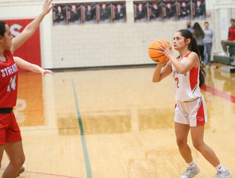 L-P's Nathali Aguirre shoots a wide-open jump shot over Streator's Isabel Gutierrez on Tuesday, Jan. 28, 2025 in Sellett Gymnasium at L-P High School.