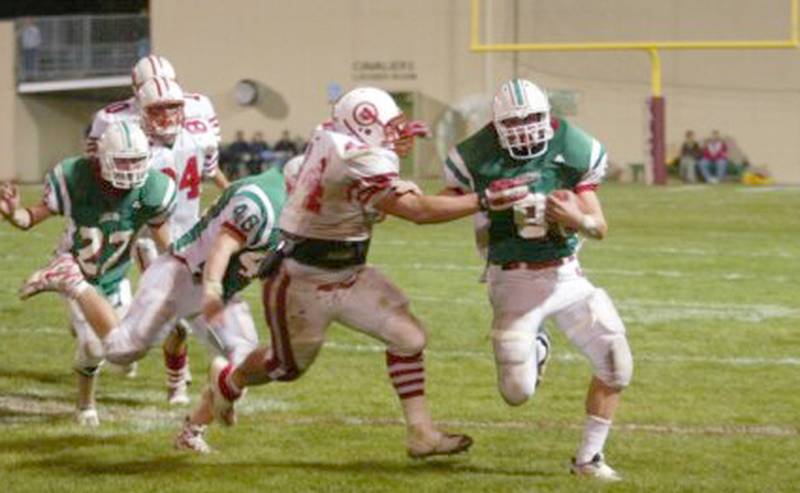 L-P's Wes Kostellic runs the ball as he is brought down by Ottawa's Garin Harcar in 2003.