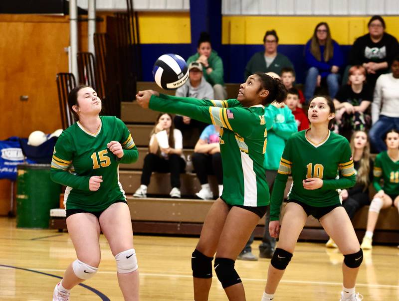 Spring Valley JFK's Miracle Wright makes a pass in Saturday's IESA Regional match at Princeton Logan as teammates Ava Crowther (15) and Isabella Carracheo (10) look on.