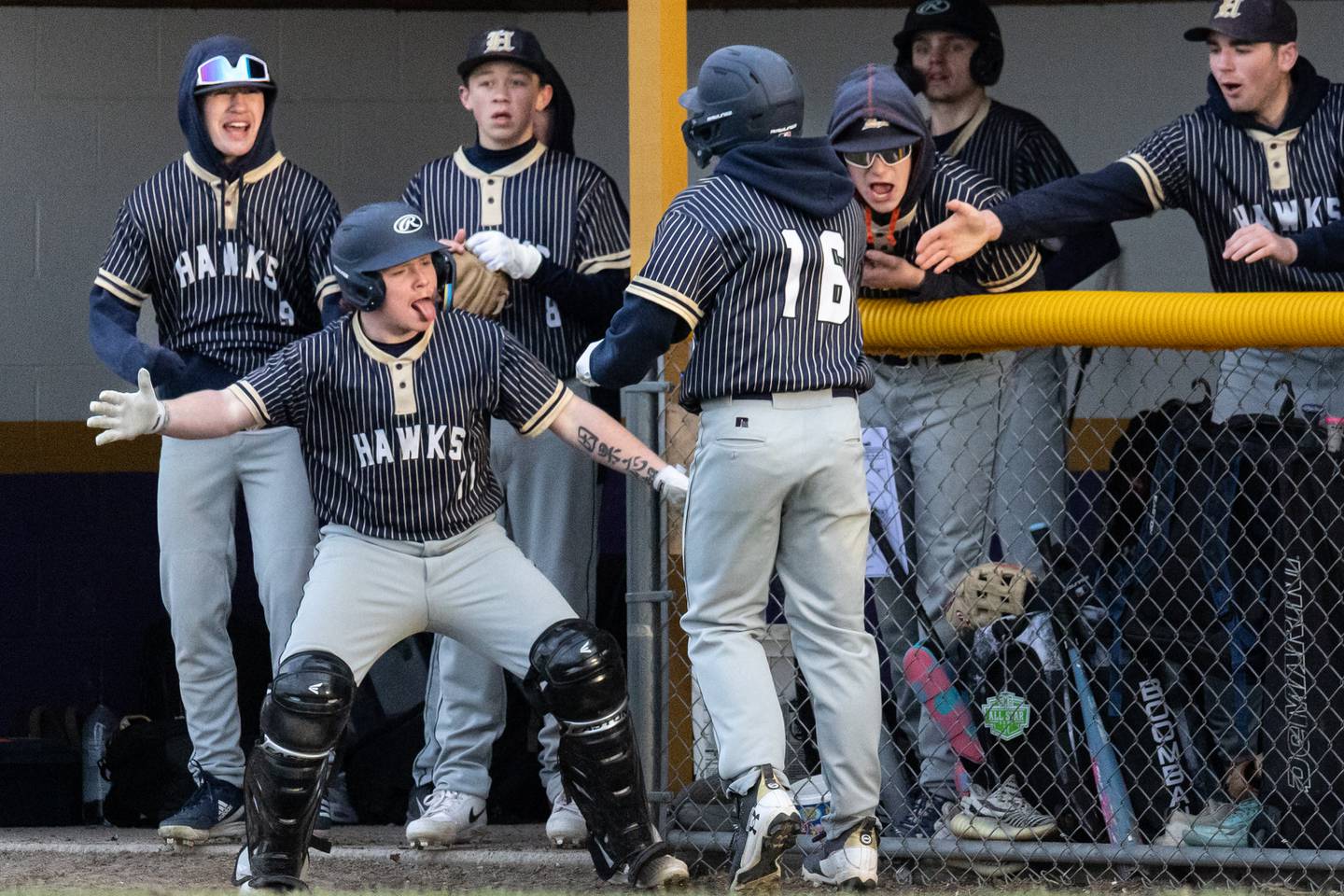 Hiawatha's Kamden Rasmus (16) receives congratulations from teammates after scoring Monday, April 7, 2025, at Serena High School in Serena.