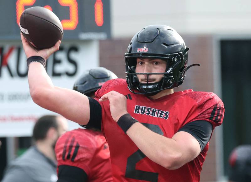 Northern Illinois University quarterback Brady Davidson throws a pass Tuesday, April 14, 2026, during spring practice in Huskie Stadium at NIU in DeKalb.