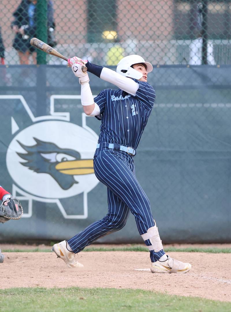 Nazareth's Jaden Fauske (21) watches his hit during the varsity baseball game between Benet Academy and Nazareth Academy in La Grange Park on Monday, April 24, 2023.
