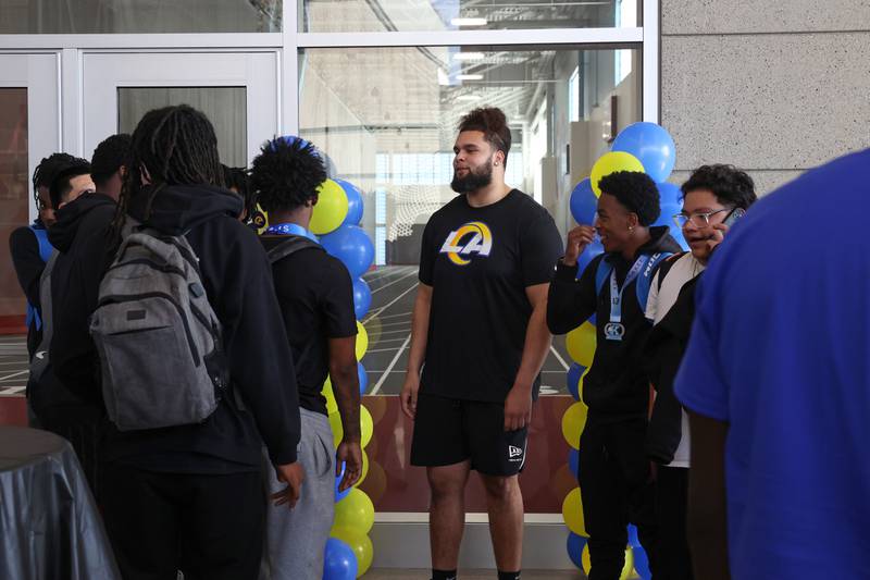 Keagen Trost, a 2019 Kankakee High School grad, talks with current Kankakee students and football players during a celebration held for him at the school on May 4, 2026, following him being drafted into the NFL to the Los Angeles Rams.