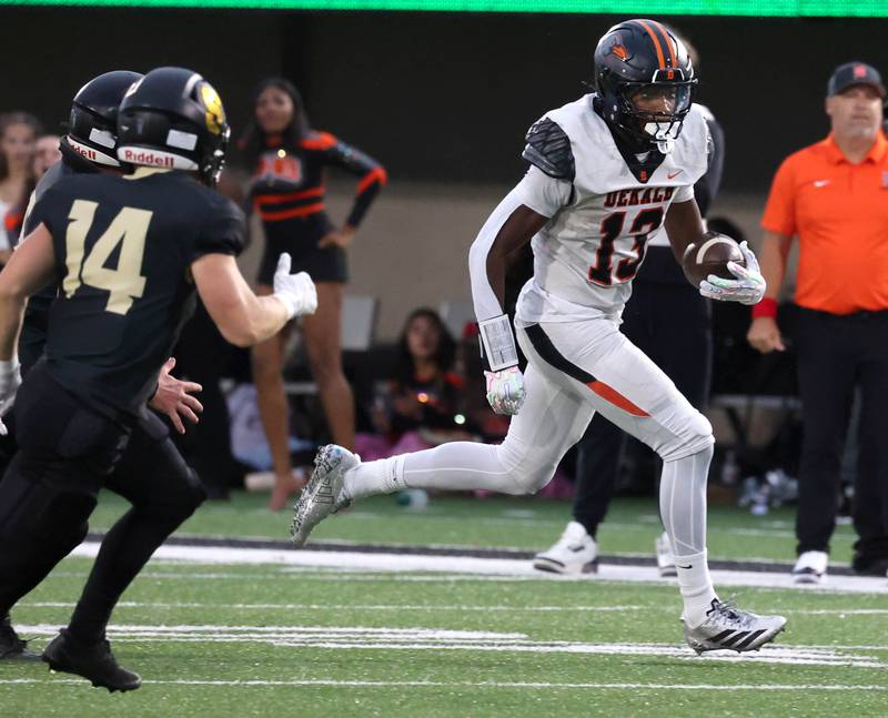 DeKalb's Davon Grant gets outside of the Sycamore defense for a gain Friday, Aug. 29, 2025, during the FNBO Challenge in Huskie Stadium at Northern Illinois University.