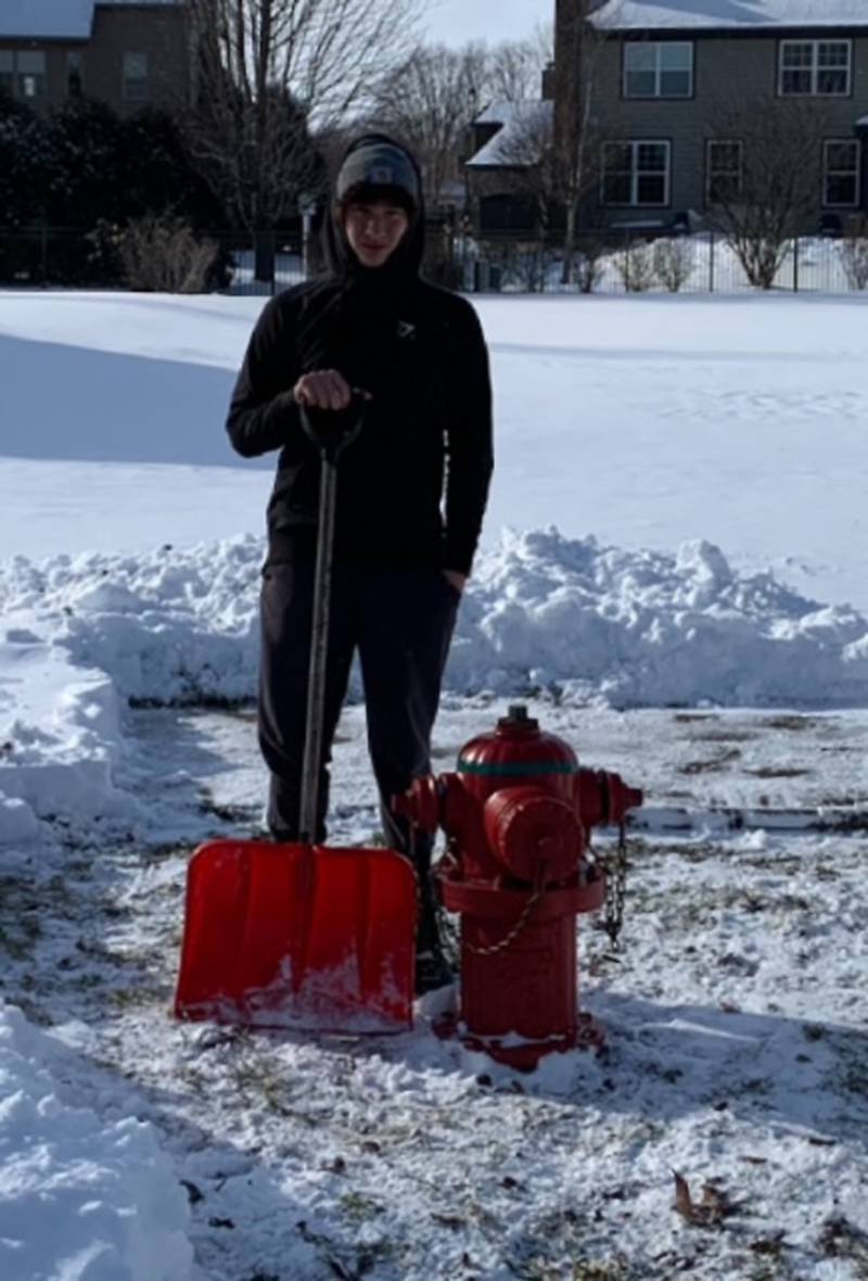 Owen Novinski after clearing out the fire hydrant near his house.